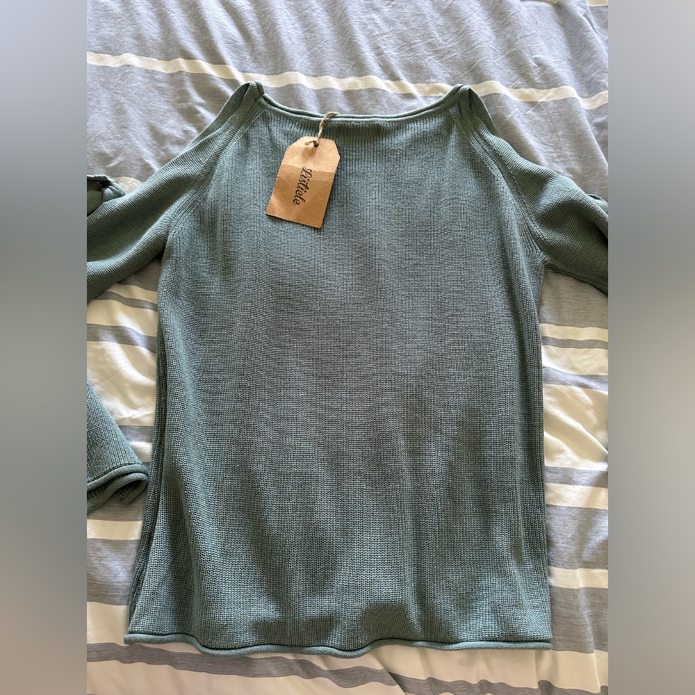 Listicle cold shoulder/cold arm sweater.